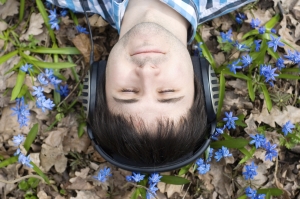 Man in headphones. Flowers