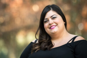 smiling woman outside wearing black