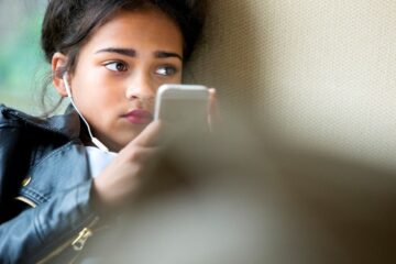 young girl with phone