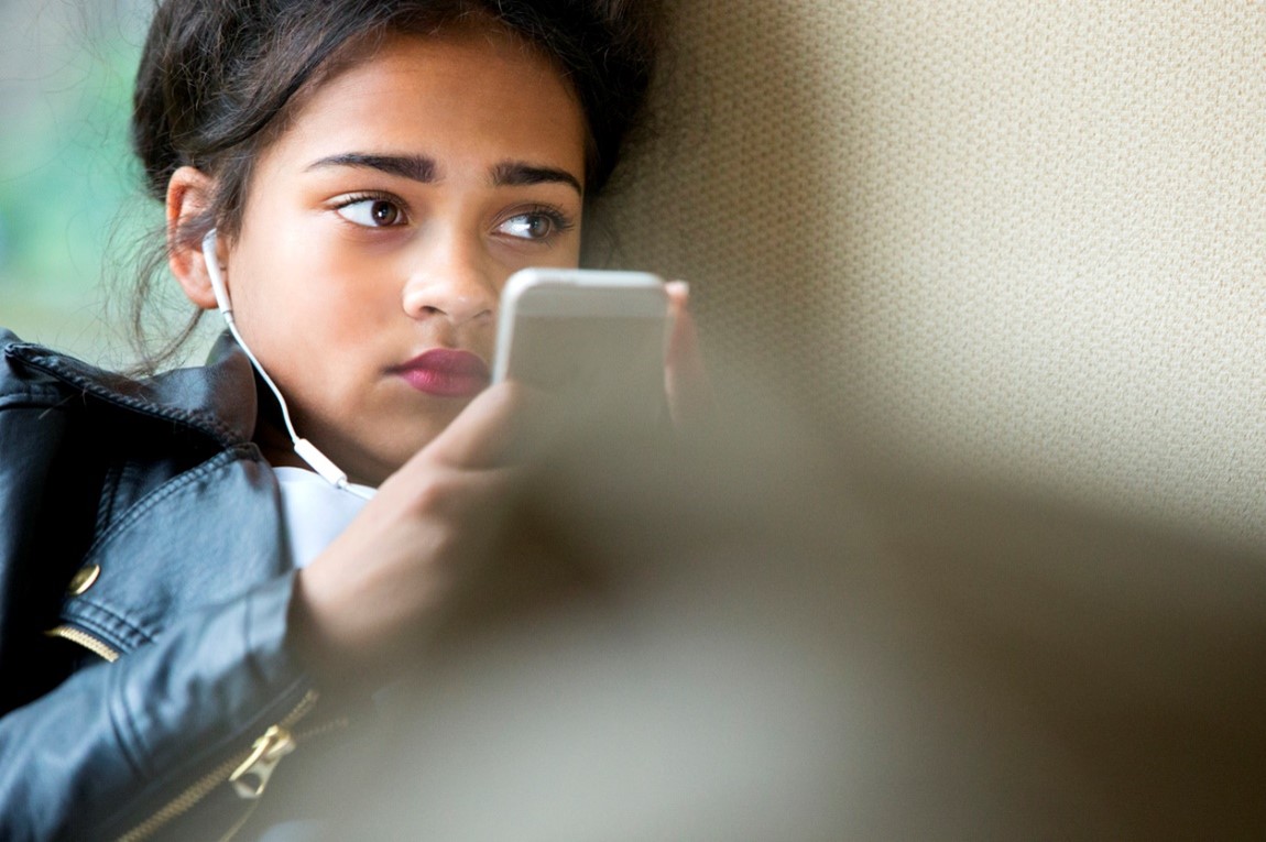 young girl with phone